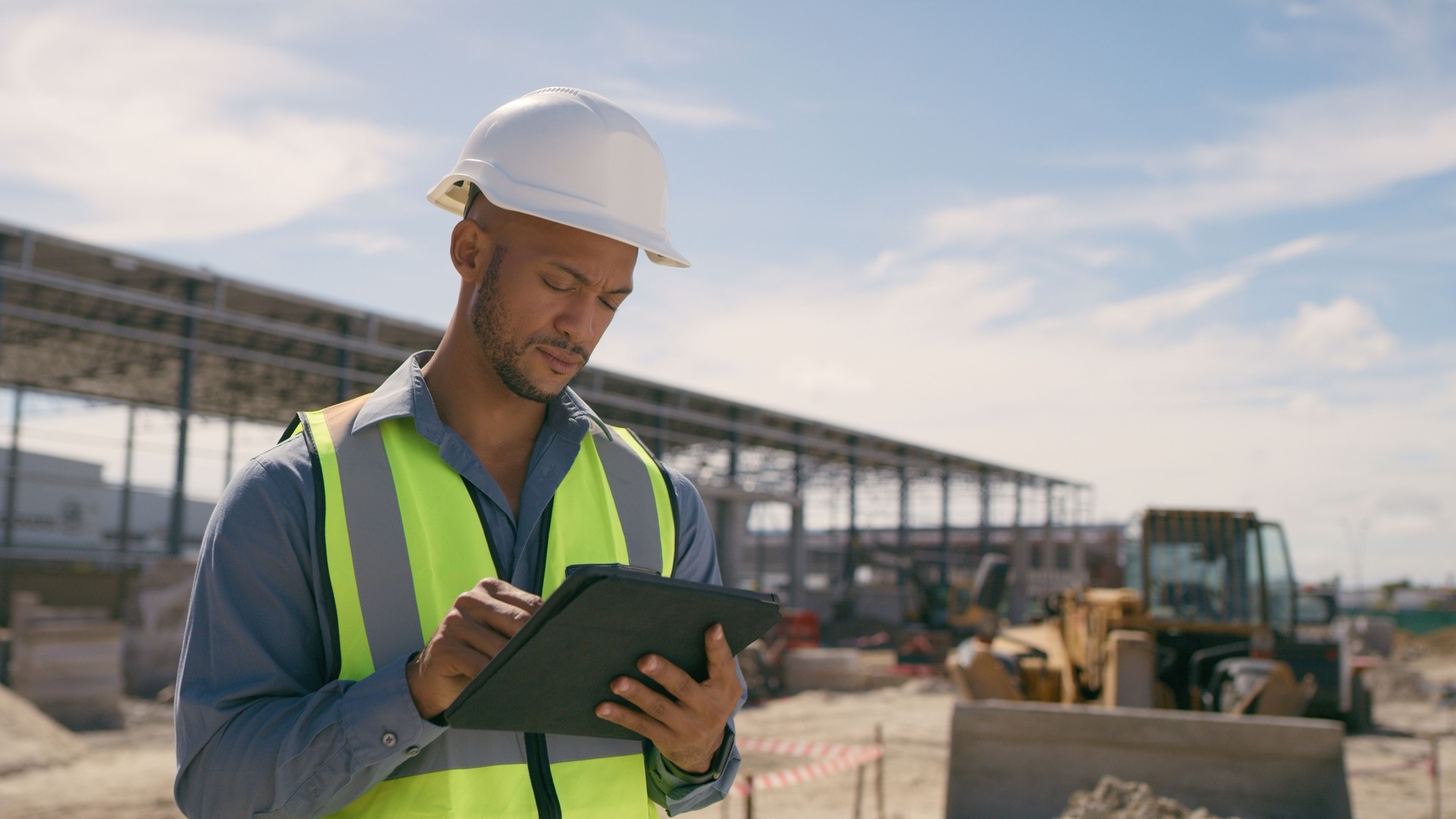 Man, construction and tablet at site for project management, building logistics or app. Male person and engineering worker on digital technology at industrial architecture design